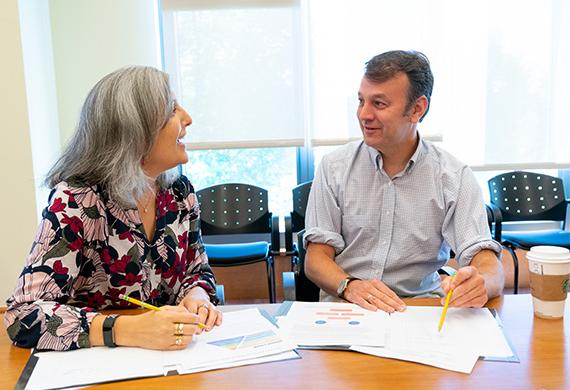 photo of Two people talking to each other